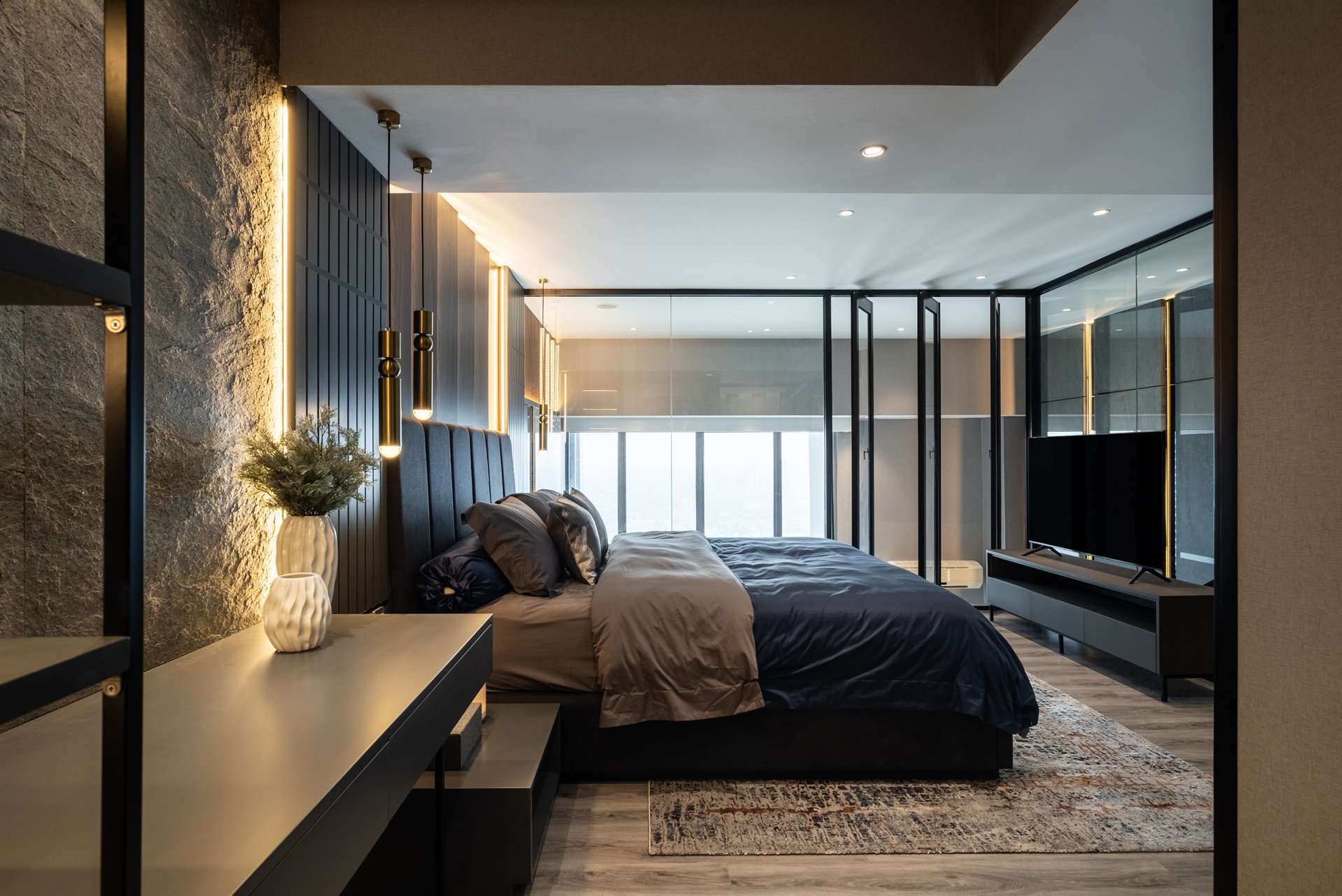 Dark contemporary bedroom with warm architectural lighting