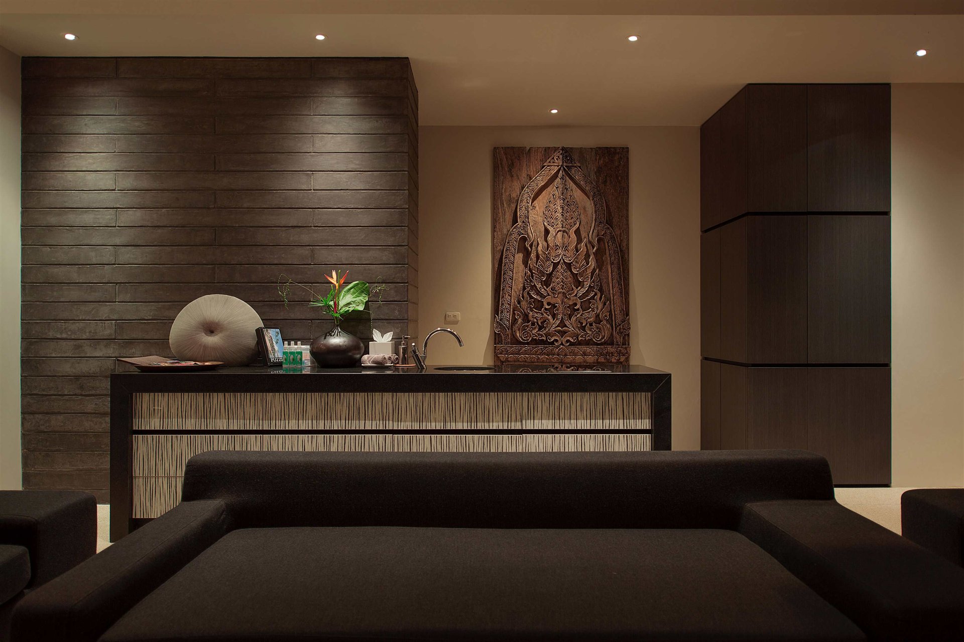 Tropical villa framed by stone, timber and landscape